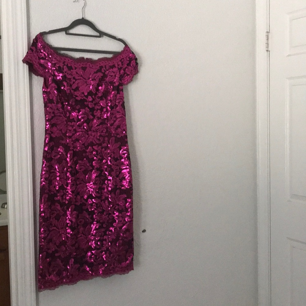 Beautiful JS collection off the shoulder dress.